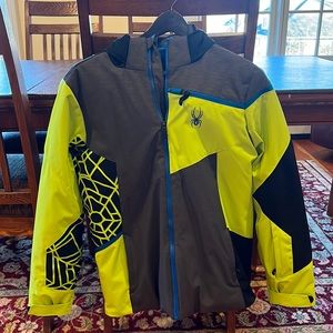Spyder men’s ski. Colors: gray, black yellow, and a little blue.